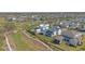 Aerial view of a residential neighborhood featuring walking trails, green spaces, and community amenities at 907 Celadon St, Winter Garden, FL 34787
