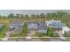 Aerial view of homes showcases the community's streetscape, manicured lawns, and proximity to the water at 907 Celadon St, Winter Garden, FL 34787