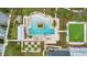 Aerial view of community pool, landscaping, parking lot and adjacent recreational area at 907 Celadon St, Winter Garden, FL 34787