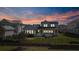 Home exterior with a spacious backyard, screened porch, and a surrounding fence at 907 Celadon St, Winter Garden, FL 34787