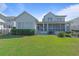 Expansive backyard showcasing a screened porch and lush green lawn, perfect for outdoor enjoyment at 907 Celadon St, Winter Garden, FL 34787