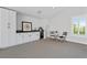 Modern bar area featuring sleek countertops, custom cabinets, a wine cooler and a table with seating at 907 Celadon St, Winter Garden, FL 34787