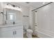 Stylish bathroom featuring marble vanity, sleek black fixtures, and a shower tub combination with chic, modern design at 907 Celadon St, Winter Garden, FL 34787