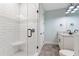 A modern bathroom with a glass-enclosed shower, white subway tile, and updated vanity at 907 Celadon St, Winter Garden, FL 34787