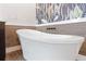 Luxurious bathroom featuring a standalone tub and designer wallpaper at 907 Celadon St, Winter Garden, FL 34787