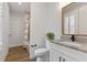 Charming bathroom features modern vanity, granite countertop, and shower-tub combination at 907 Celadon St, Winter Garden, FL 34787