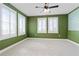 Spacious bedroom features natural light from multiple windows with bright white shutters at 907 Celadon St, Winter Garden, FL 34787