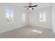 Bright, carpeted bedroom featuring white walls and shutters, offering lots of light for a clean, serene atmosphere at 907 Celadon St, Winter Garden, FL 34787