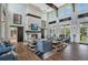 Clubhouse featuring high ceilings, fireplace, exposed brick, wood floors, and ample seating at 907 Celadon St, Winter Garden, FL 34787