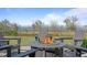 Inviting outdoor fire pit area with comfortable seating and scenic water views at 907 Celadon St, Winter Garden, FL 34787