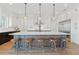 Spacious kitchen featuring a large island with bar seating, stainless steel appliances, and pendant lighting at 907 Celadon St, Winter Garden, FL 34787