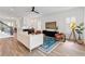 Open-concept living room features shiplap walls, wood-look tile, modern decor, and a nearby staircase at 907 Celadon St, Winter Garden, FL 34787