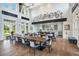 A stylish lounge area with high ceilings, industrial-chic decor, and modern furnishings at 907 Celadon St, Winter Garden, FL 34787