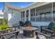 Outdoor patio features a modern fire pit and comfortable seating, ideal for relaxation and entertainment at 907 Celadon St, Winter Garden, FL 34787