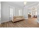 Sitting room featuring a sofa and windows, leading to an adjacent office space at 907 Celadon St, Winter Garden, FL 34787