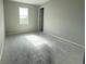 Bright, open bedroom with large window to let in sunlight at 960 Hawksnest Pt, Oviedo, FL 32765