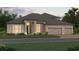 Beautifully landscaped single-Gathering home with a manicured lawn and a three car garage, creating great curb appeal at 960 Hawksnest Pt, Oviedo, FL 32765