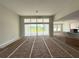 Open living room features large sliding glass doors for natural light and backyard views at 960 Hawksnest Pt, Oviedo, FL 32765