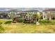 Well-maintained backyard with lush landscaping and an in-ground pool at 9574 Meadow Hunt Way, Winter Garden, FL 34787