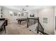 Game room featuring a pool table, ceiling fan, and staircase with decorative wrought iron at 9574 Meadow Hunt Way, Winter Garden, FL 34787