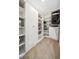 Spacious walk-in closet with built-in shelving and storage at 9574 Meadow Hunt Way, Winter Garden, FL 34787