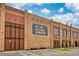 Commercial brick building with parking and visible signage at 9574 Meadow Hunt Way, Winter Garden, FL 34787