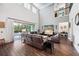 Spacious living room with high ceilings and views of the screened-in pool area at 9574 Meadow Hunt Way, Winter Garden, FL 34787