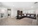 Large living area with plush seating, neutral decor, and lots of natural light at 9574 Meadow Hunt Way, Winter Garden, FL 34787