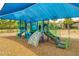 Community playground featuring slides, climbing structures, and a shaded play area for enjoyment at 9574 Meadow Hunt Way, Winter Garden, FL 34787