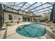Inviting pool area with a covered kitchen and outdoor lounge space at 9574 Meadow Hunt Way, Winter Garden, FL 34787