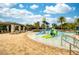 Community splash pad featuring a slide and water features, perfect for Gathering fun on a sunny day at 9574 Meadow Hunt Way, Winter Garden, FL 34787