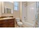 Bright bathroom with a shower-tub combo, a single sink vanity, and neutral colors at 1023 Hermosa Way, Kissimmee, FL 34744