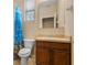Compact bathroom with a shower-tub combo and ample lighting at 1023 Hermosa Way, Kissimmee, FL 34744