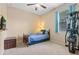 Bedroom featuring a twin bed, a window, and exercise equipment at 1023 Hermosa Way, Kissimmee, FL 34744