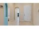 Bright and spacious foyer with tile flooring, arched doorways, and neutral paint at 1023 Hermosa Way, Kissimmee, FL 34744