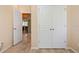 Hallway showing entry to the kitchen and closet space at 1023 Hermosa Way, Kissimmee, FL 34744