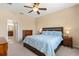 Spacious main bedroom featuring an ensuite bathroom and dresser at 1023 Hermosa Way, Kissimmee, FL 34744