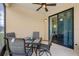 Screened patio with table and chairs and a ceiling fan, with sliding door to indoor space at 1023 Hermosa Way, Kissimmee, FL 34744