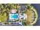 Community aerial view featuring a pool, playground and common area, with well-maintained landscaping, and lake at 1131 Indigo Dr, Celebration, FL 34747