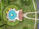 Aerial view of the community pool showcasing its design, surrounding landscaping and amenities at 1131 Indigo Dr, Celebration, FL 34747