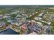 Aerial view of a town that features stores, office buildings, apartments, parking, and natural features like a lake at 1131 Indigo Dr, Celebration, FL 34747