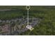 An aerial view shows the home's location among lush trees in a well-maintained community at 1131 Indigo Dr, Kissimmee, FL 34747