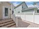 Charming home featuring a brick-paved patio and white picket fence, creating a cozy outdoor retreat at 1131 Indigo Dr, Kissimmee, FL 34747