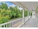 Balcony overlooking a lush backyard with trees at 1131 Indigo Dr, Kissimmee, FL 34747