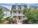 Charming two-story home with a welcoming front porch and second story balcony at 1131 Indigo Dr, Kissimmee, FL 34747