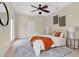 Bedroom with a ceiling fan, gray rug, and a sliding glass door at 1131 Indigo Dr, Kissimmee, FL 34747