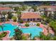 Aerial view of community clubhouse, pool, and landscaping, offering a resort-style living experience at 1180 S Beach Cir, Kissimmee, FL 34746