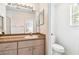 Bright bathroom features a large mirror and a spacious vanity with storage at 1180 S Beach Cir, Kissimmee, FL 34746