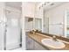 Modern bathroom features a shower and a large mirror over the vanity at 1180 S Beach Cir, Kissimmee, FL 34746