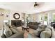 Comfortable clubhouse lounge area featuring plush seating, a fireplace, and access to the outdoor pool at 1180 S Beach Cir, Kissimmee, FL 34746